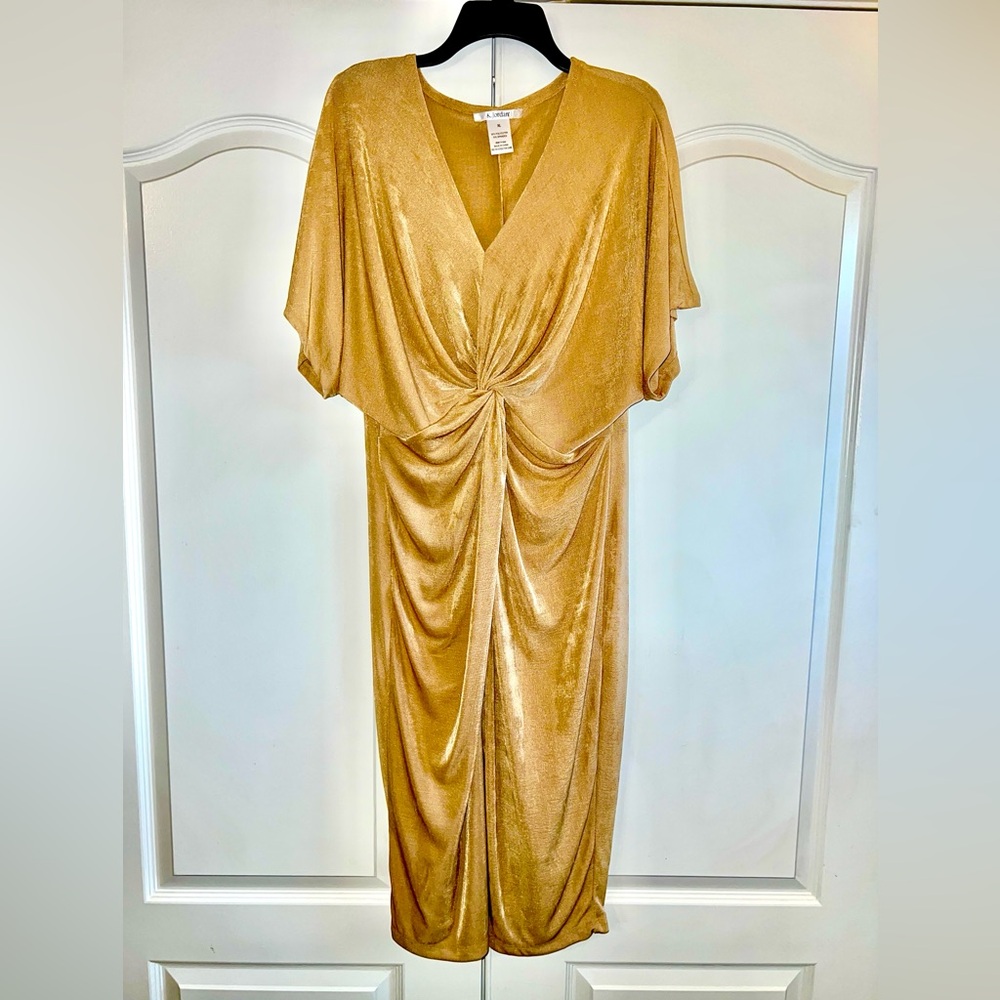 Figure skimming golden dress, knotted with a forgiving cut